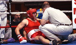 A boxer is knocked down and receives the 10 count.